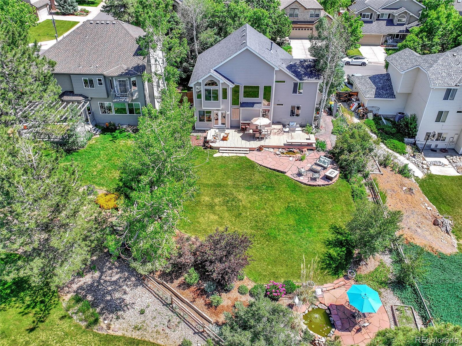 9754 Chanteclair Circle Highlands Ranch, CO 80126 - Photo 47 of 47 a front view of a house with a garden