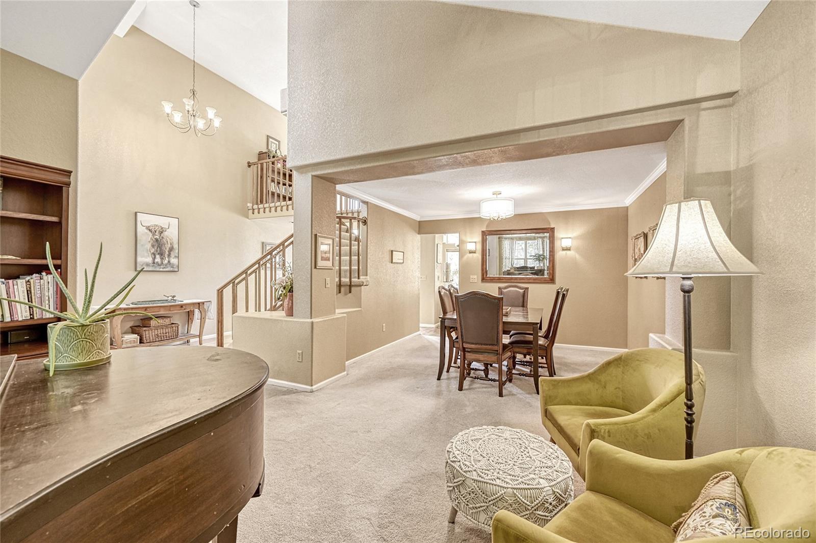 9754 Chanteclair Circle Highlands Ranch, CO 80126 - Photo 5 of 47 a living room with furniture and wooden floor