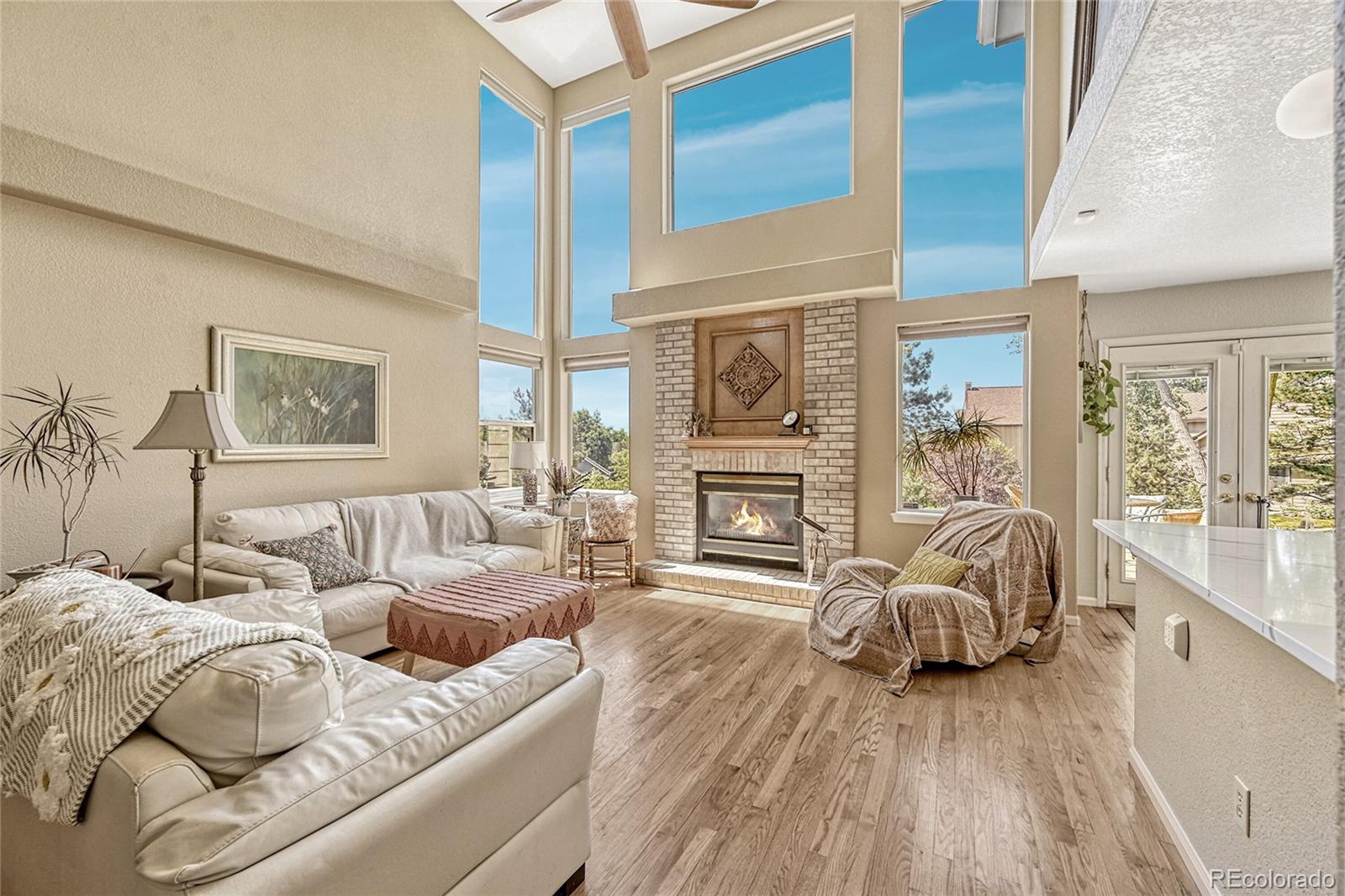 9754 Chanteclair Circle Highlands Ranch, CO 80126 - Photo 7 of 47 a living room with furniture and a large window