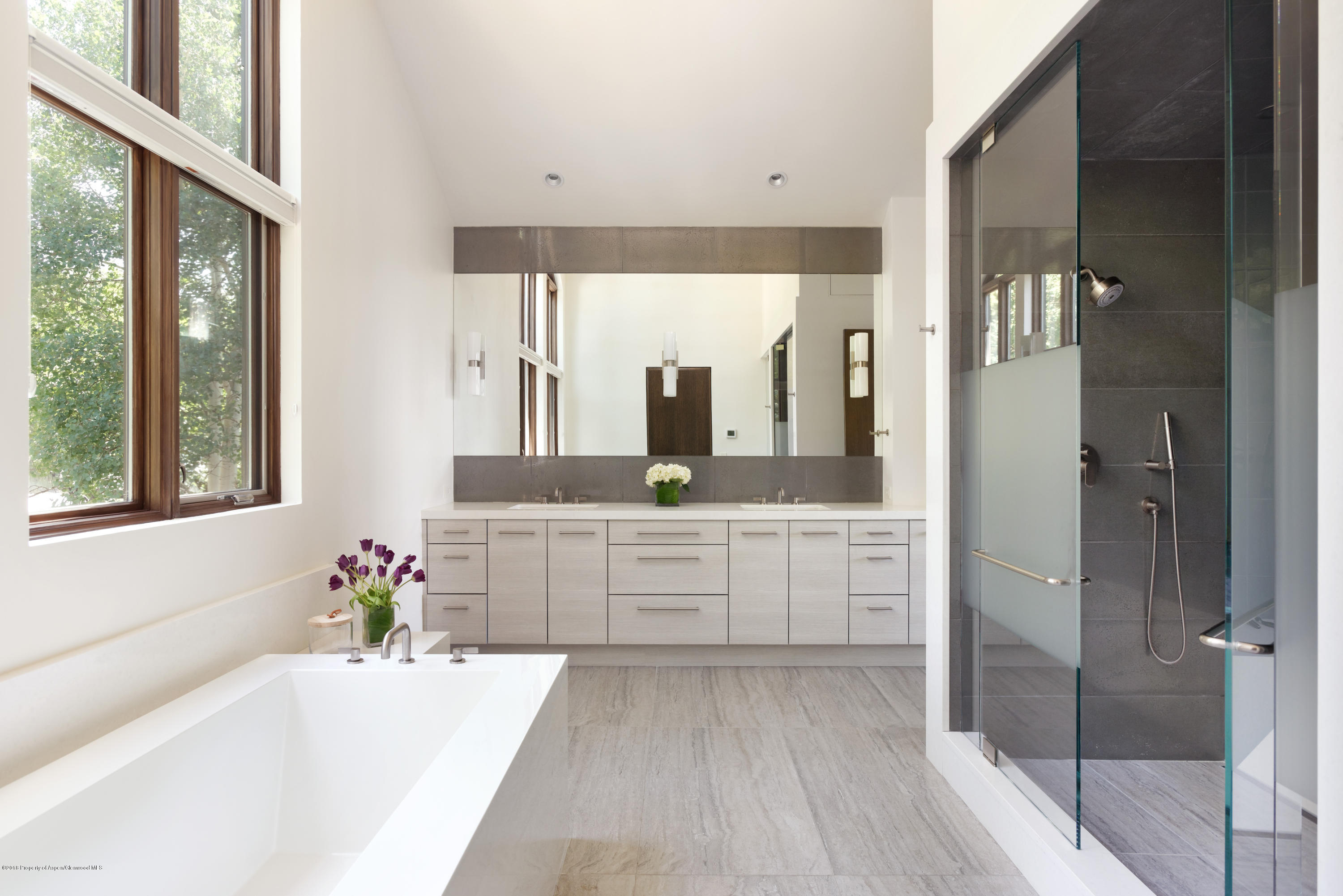 274 Draw Drive Aspen, CO 81612 - Photo 11 of 32 a spacious bathroom with a granite countertop sink mirror and a bathtub