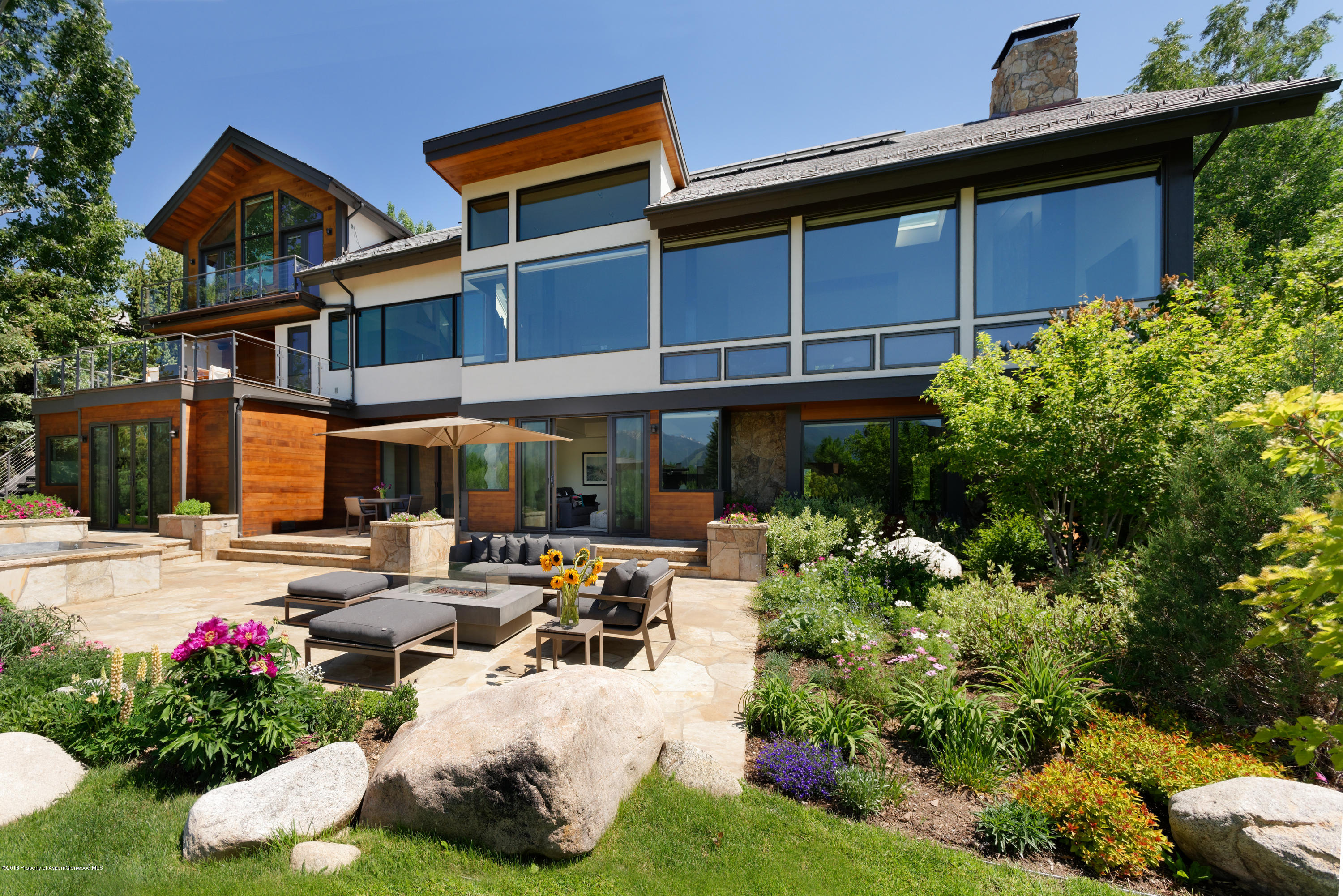 274 Draw Drive Aspen, CO 81612 - Photo 12 of 32 a row of table and chairs in front of house