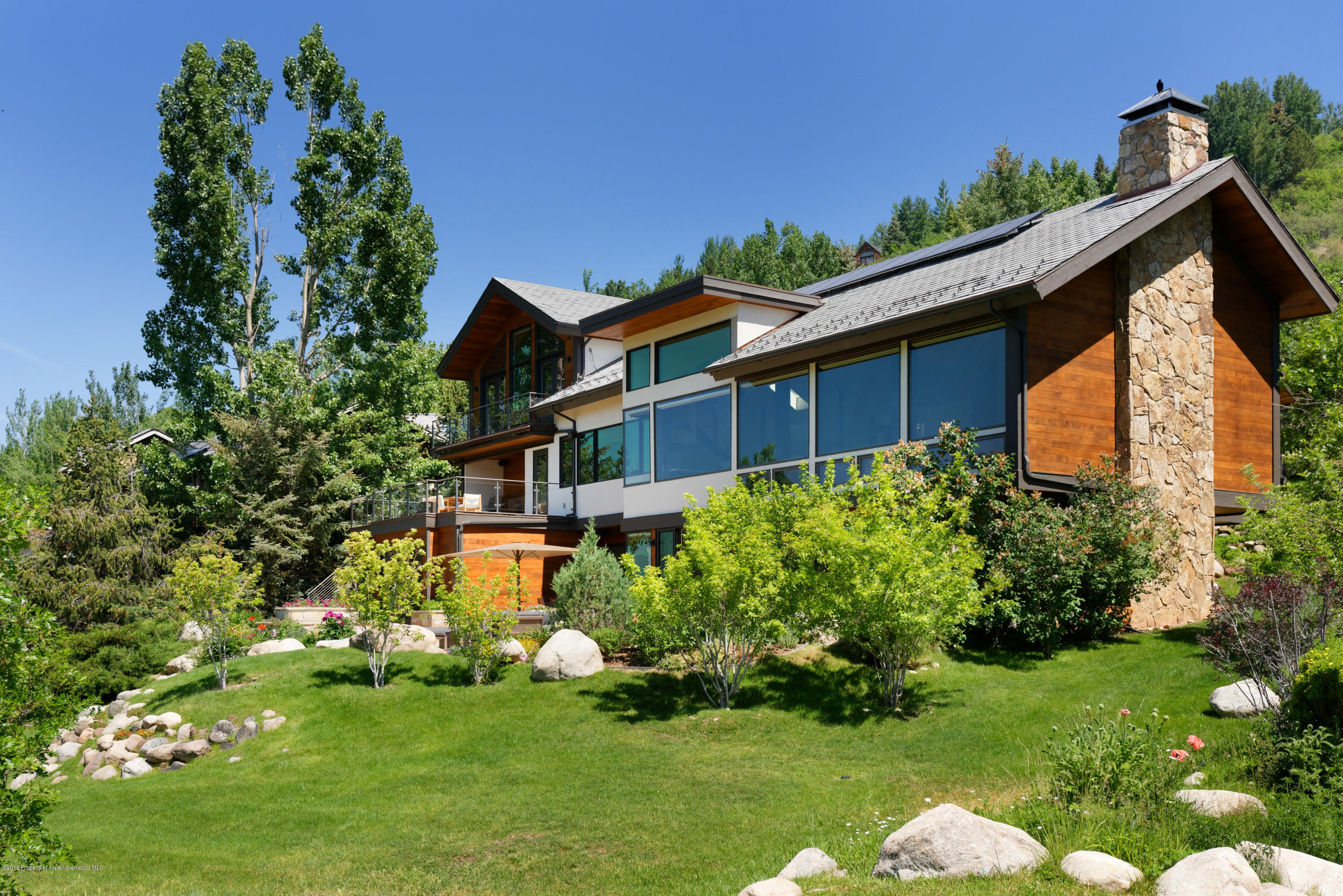 274 Draw Drive Aspen, CO 81612 - Photo 18 of 32 a front view of a house with a yard