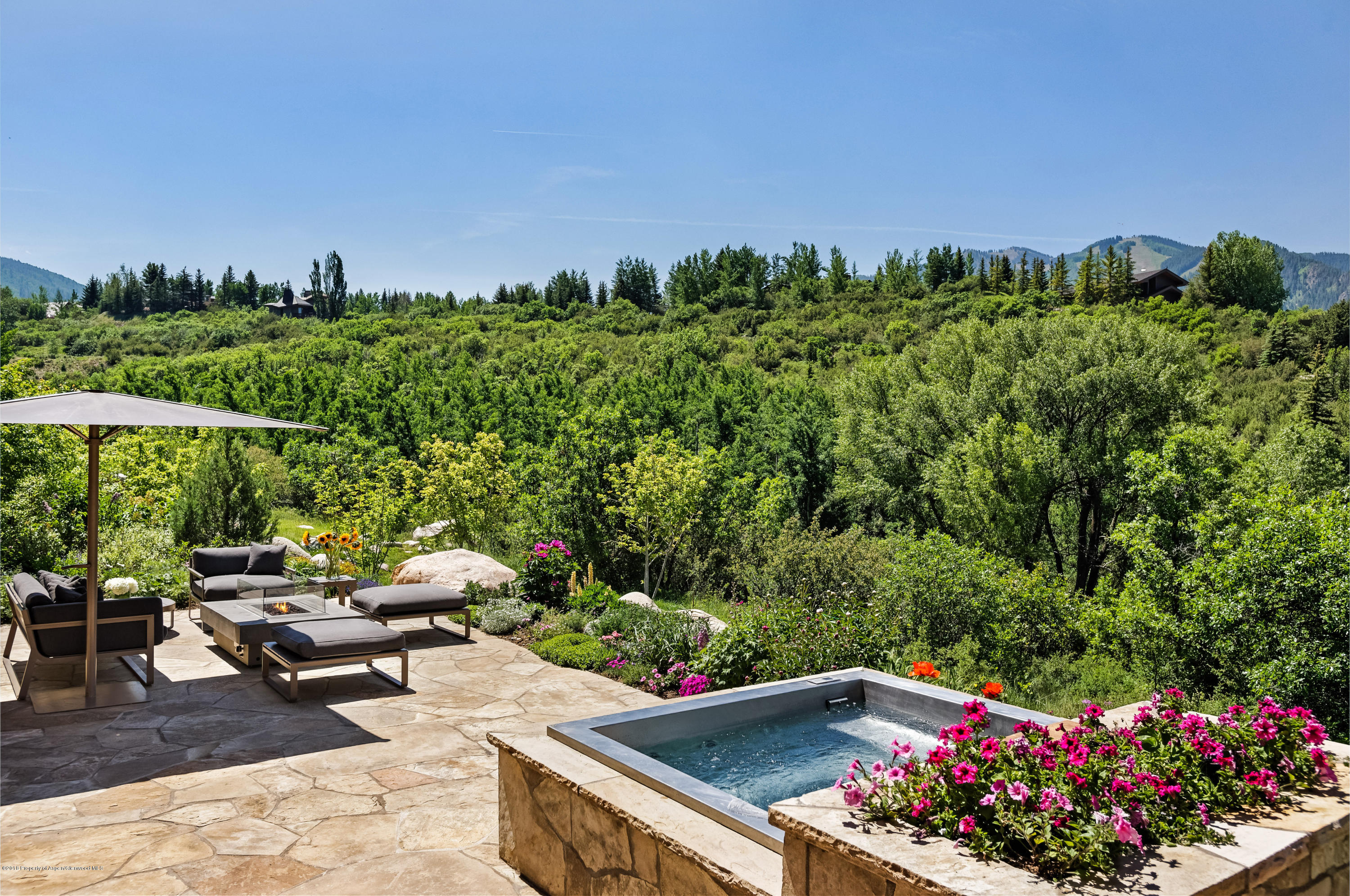 274 Draw Drive Aspen, CO 81612 - Photo 23 of 32 a view of a chairs and table in a yard