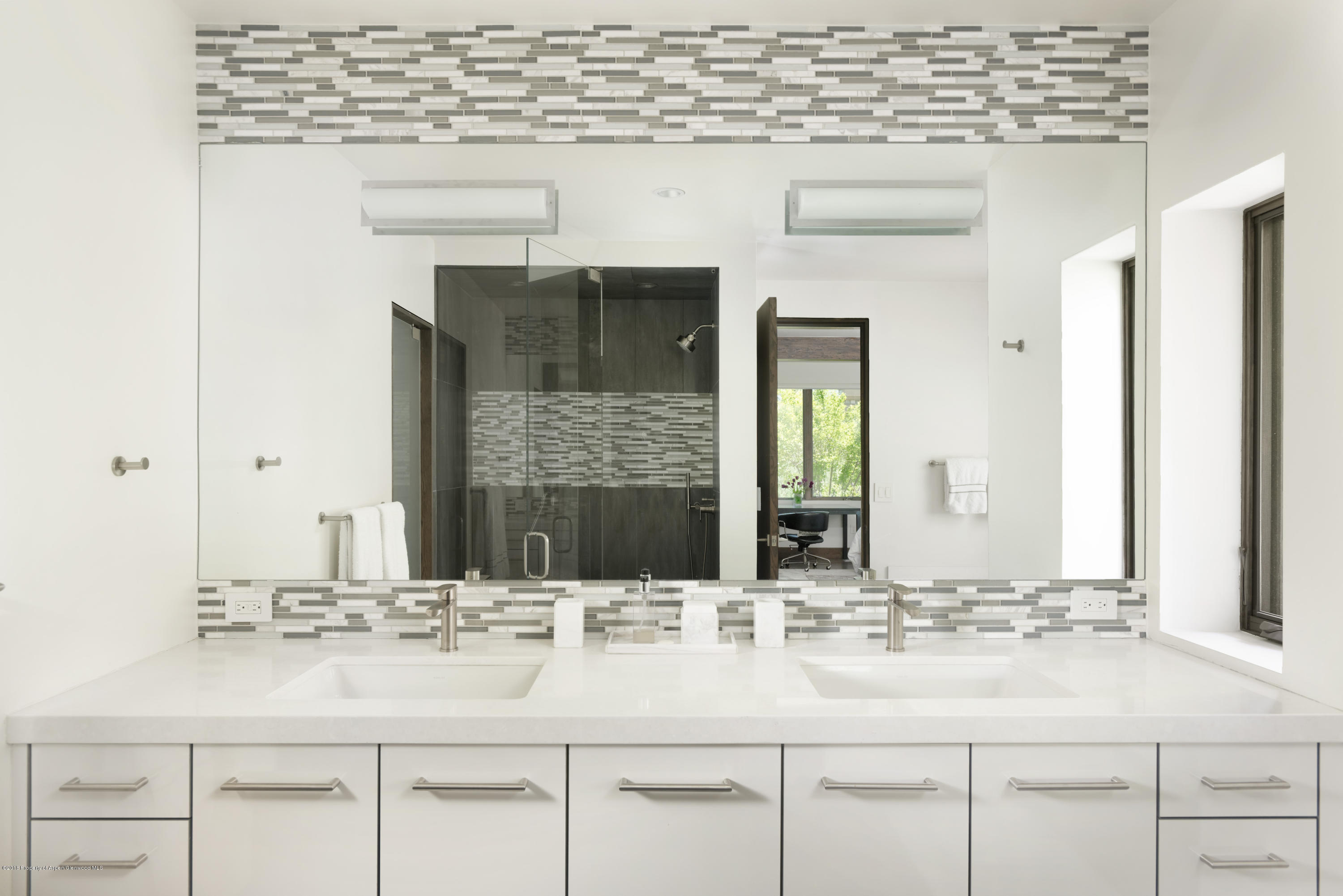 274 Draw Drive Aspen, CO 81612 - Photo 26 of 32 a bathroom with vanity sink and a mirror