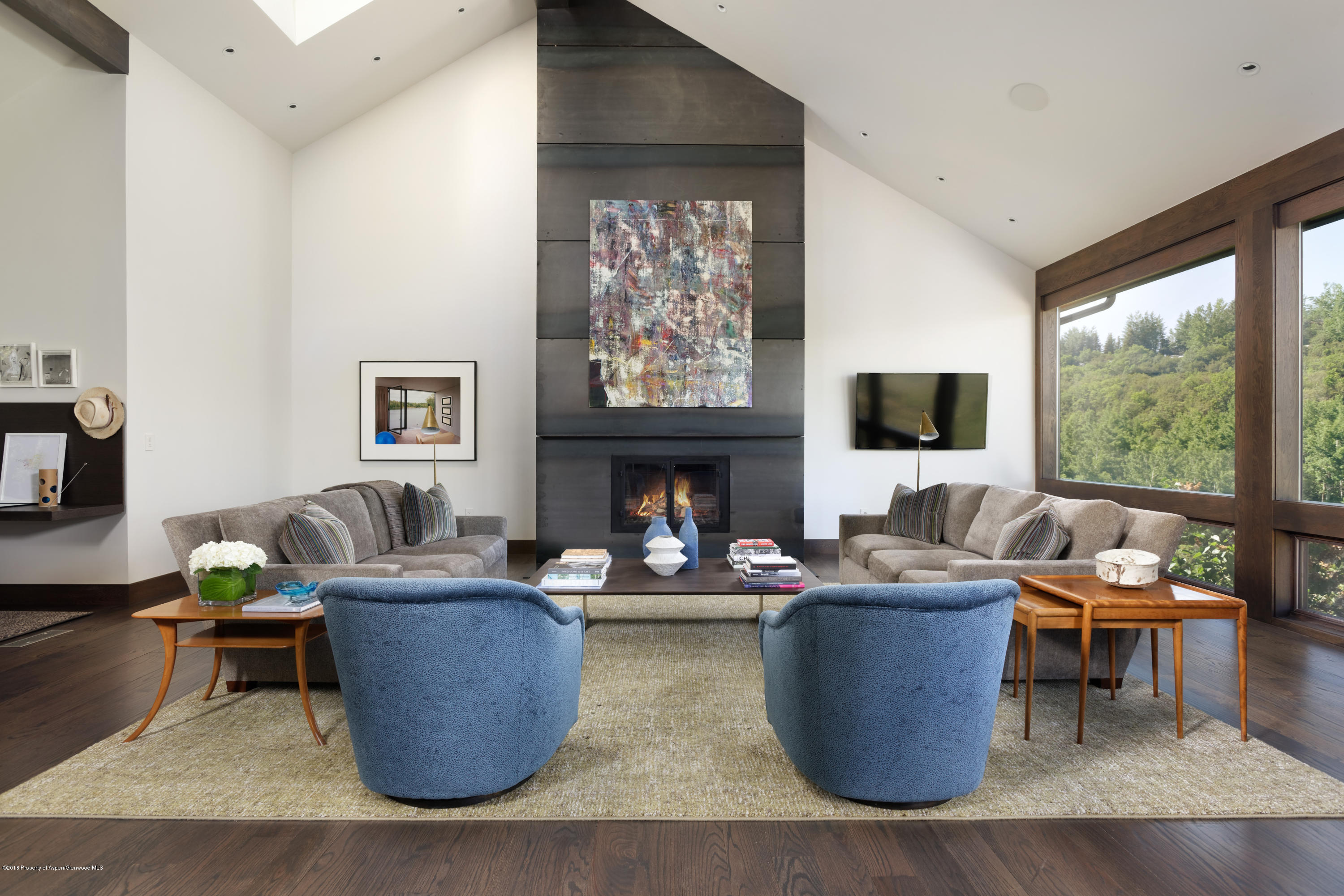 274 Draw Drive Aspen, CO 81612 - Photo 3 of 32 a living room with fireplace furniture and a large window