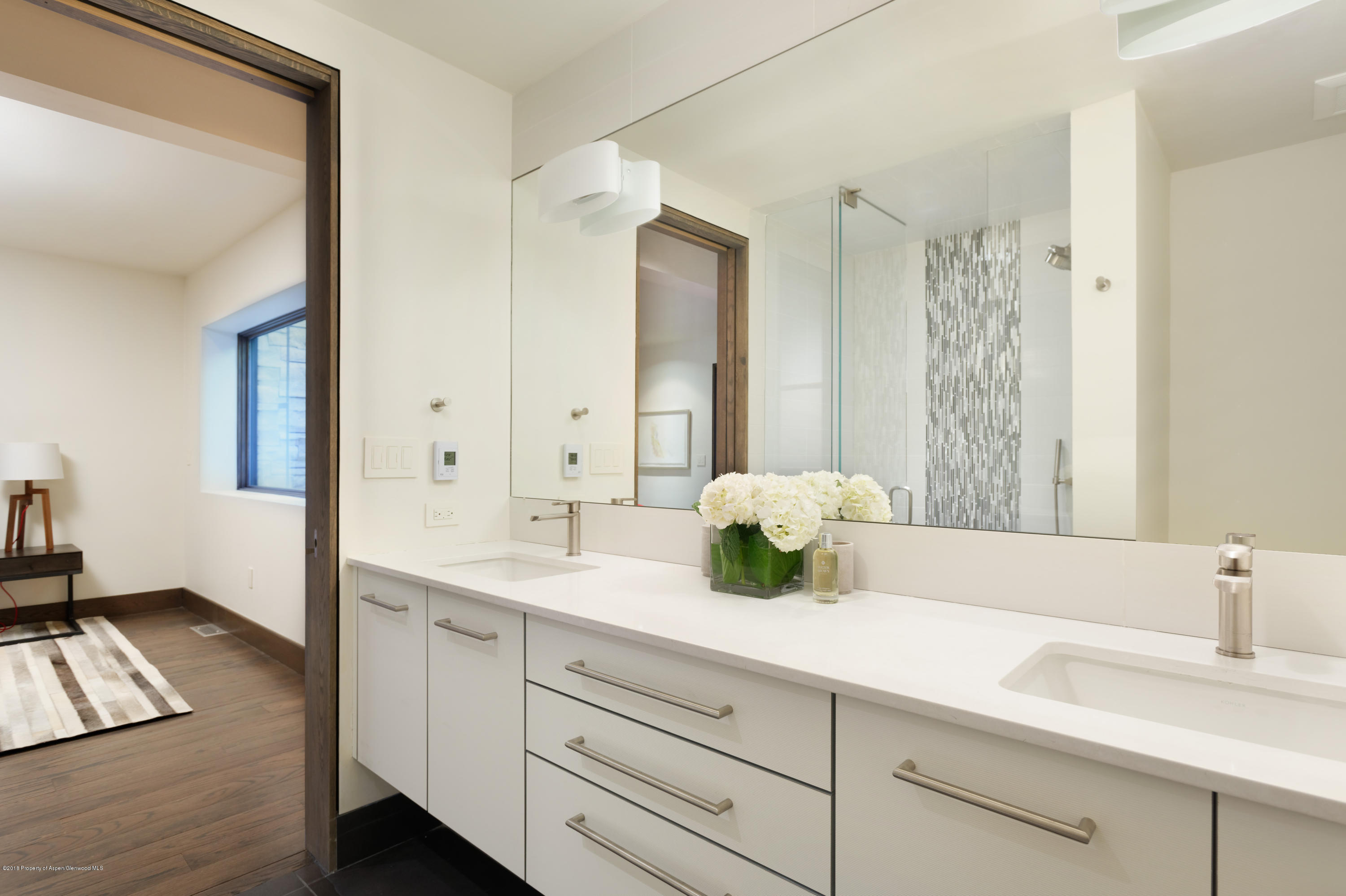 274 Draw Drive Aspen, CO 81612 - Photo 32 of 32 a bathroom with a granite countertop sink mirror and double
