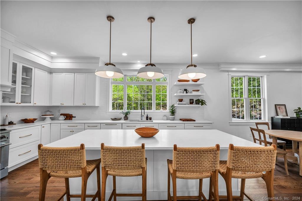 38 Opening Hill Road Madison, CT 06443 - Photo 4 of 11 a kitchen with furniture a large window and chairs