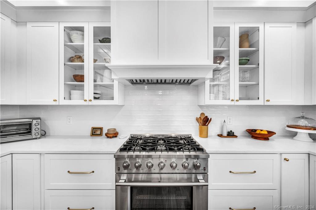 38 Opening Hill Road Madison, CT 06443 - Photo 6 of 11 a kitchen with a stove and cabinets