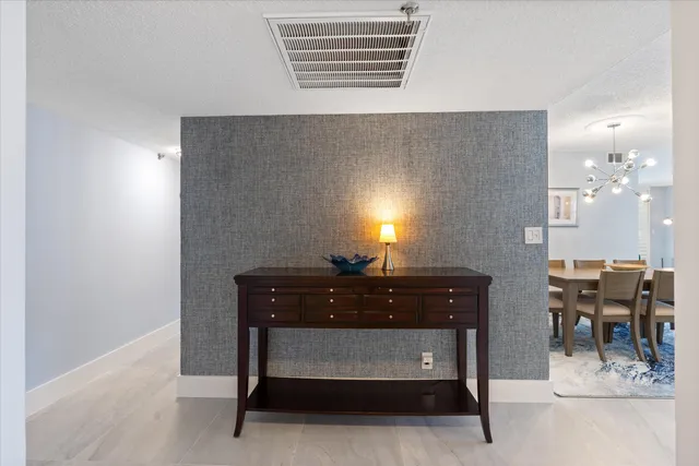 a room with furniture and paintings