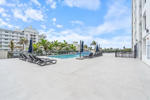 a view of a swimming pool with a lounge chair