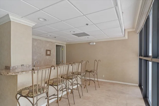 a kitchen with a refrigerator sink and cabinets