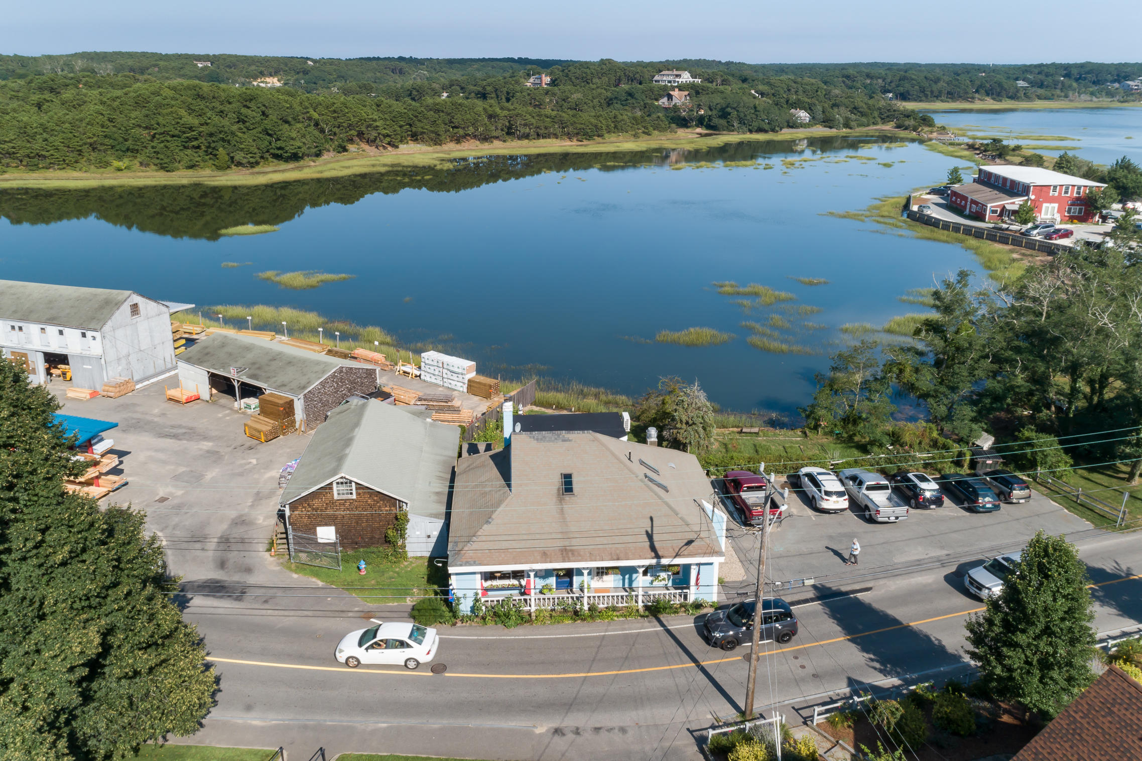 an aerial view of a house with a lake view