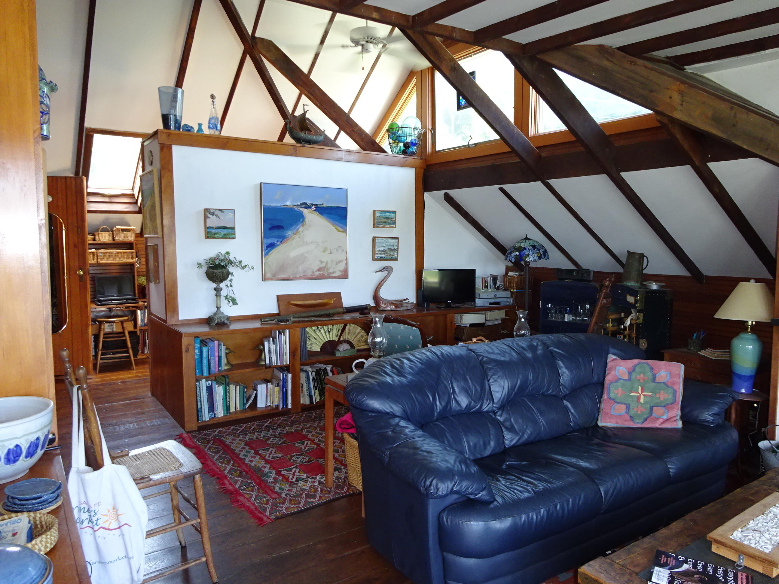 55 Commercial Street Wellfleet, MA 02667 - Photo 16 of 35 a living room with furniture and a fireplace