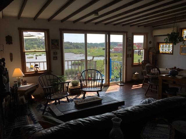 55 Commercial Street Wellfleet, MA 02667 - Photo 18 of 35 a living room with furniture floor to ceiling window and wooden floor