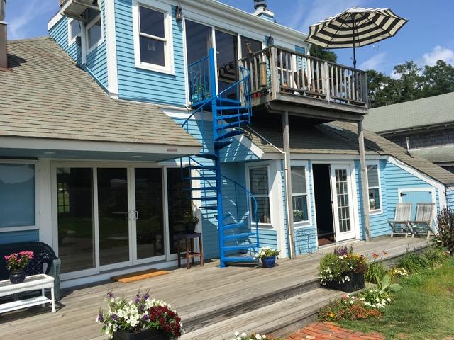 55 Commercial Street Wellfleet, MA 02667 - Photo 20 of 35 a front view of a house with a yard