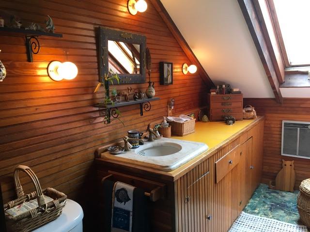 55 Commercial Street Wellfleet, MA 02667 - Photo 22 of 35 a bathroom with a sink and a mirror