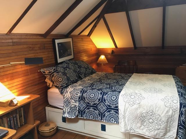 55 Commercial Street Wellfleet, MA 02667 - Photo 23 of 35 a bedroom with a bed and a window