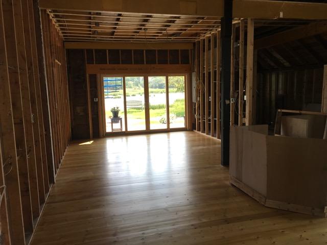 55 Commercial Street Wellfleet, MA 02667 - Photo 30 of 35 a view of a room with wooden floor and a window