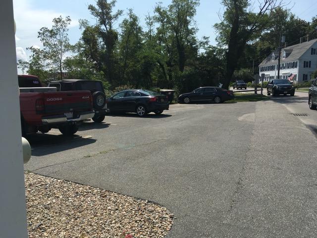 55 Commercial Street Wellfleet, MA 02667 - Photo 31 of 35 a view of car parked on the side of a street