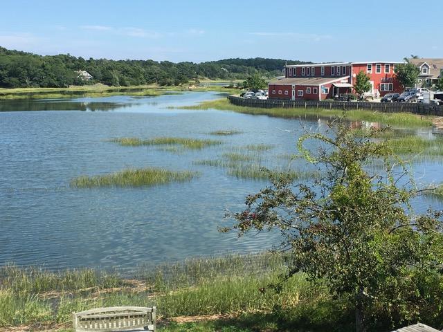55 Commercial Street Wellfleet, MA 02667 - Photo 32 of 35 a view of a lake with houses in the back
