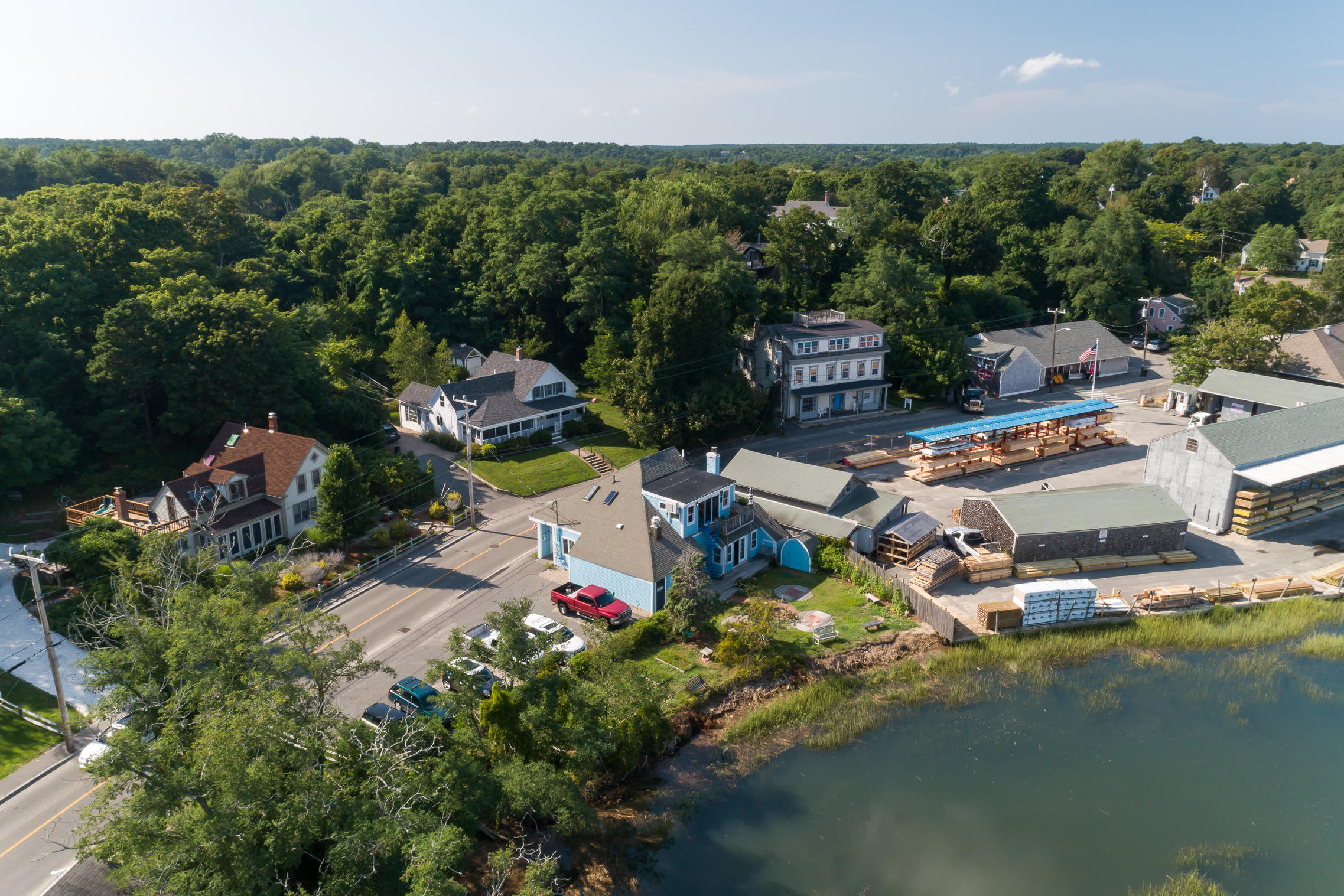 55 Commercial Street Wellfleet, MA 02667 - Photo 4 of 35 an aerial view of a house with a garden and lake view