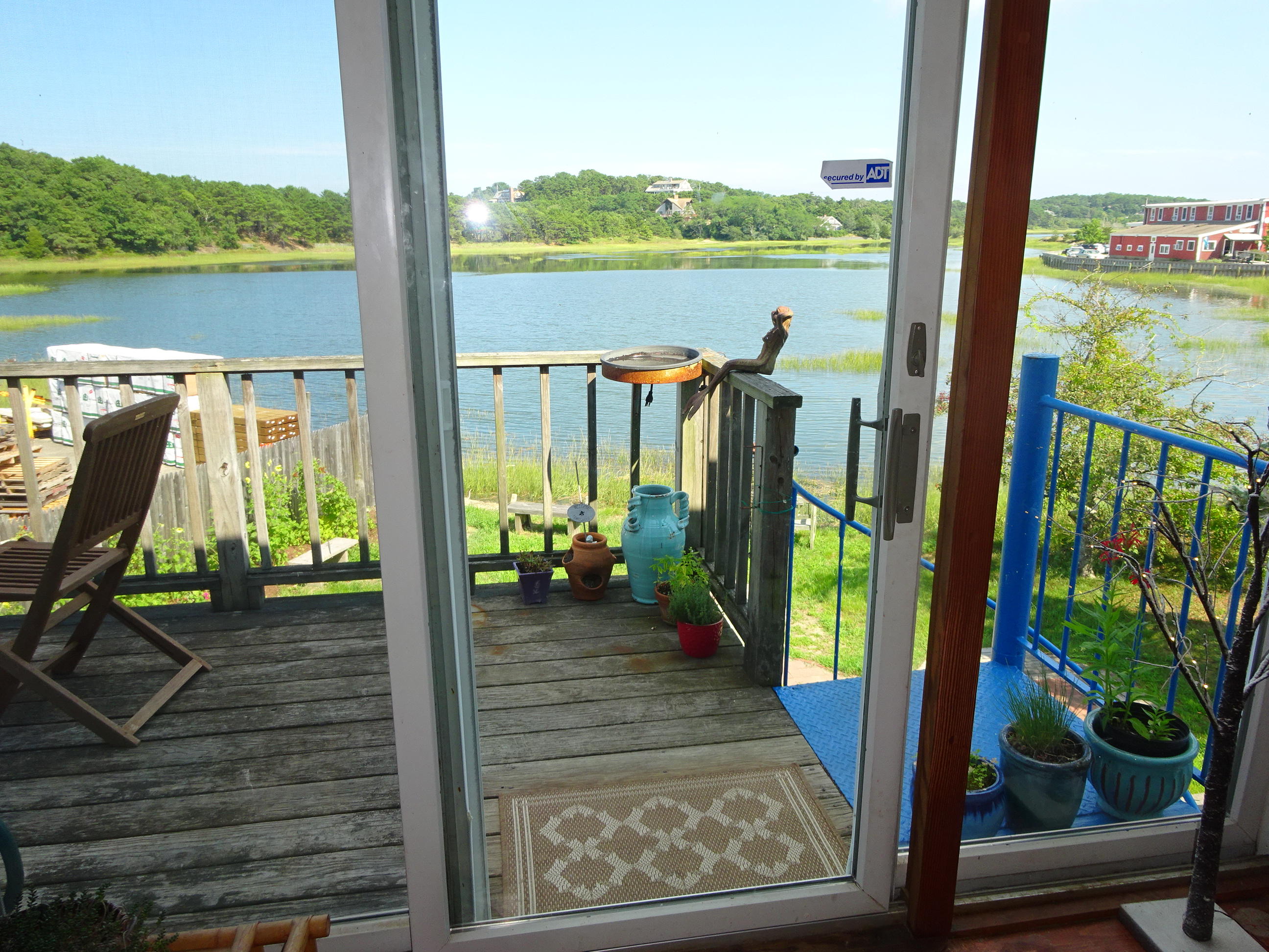 55 Commercial Street Wellfleet, MA 02667 - Photo 7 of 35 a view of deck with furniture and garden view