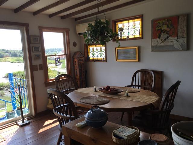 55 Commercial Street Wellfleet, MA 02667 - Photo 9 of 35 a view of a dining room with furniture window and wooden floor