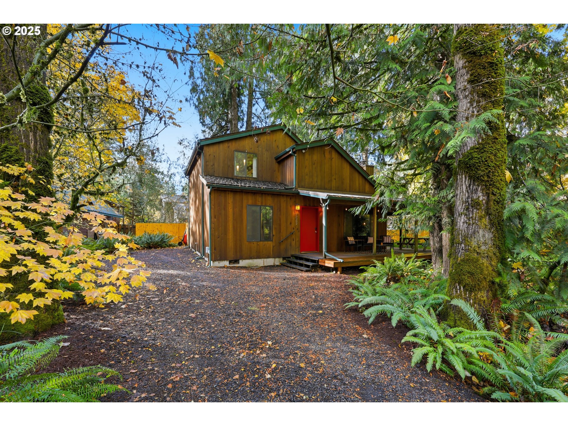 a view of a wooden house with a yard