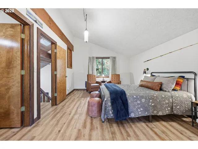 a living room with furniture and a lamp