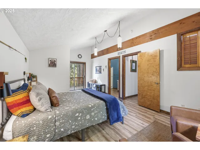 a bedroom with furniture and a window