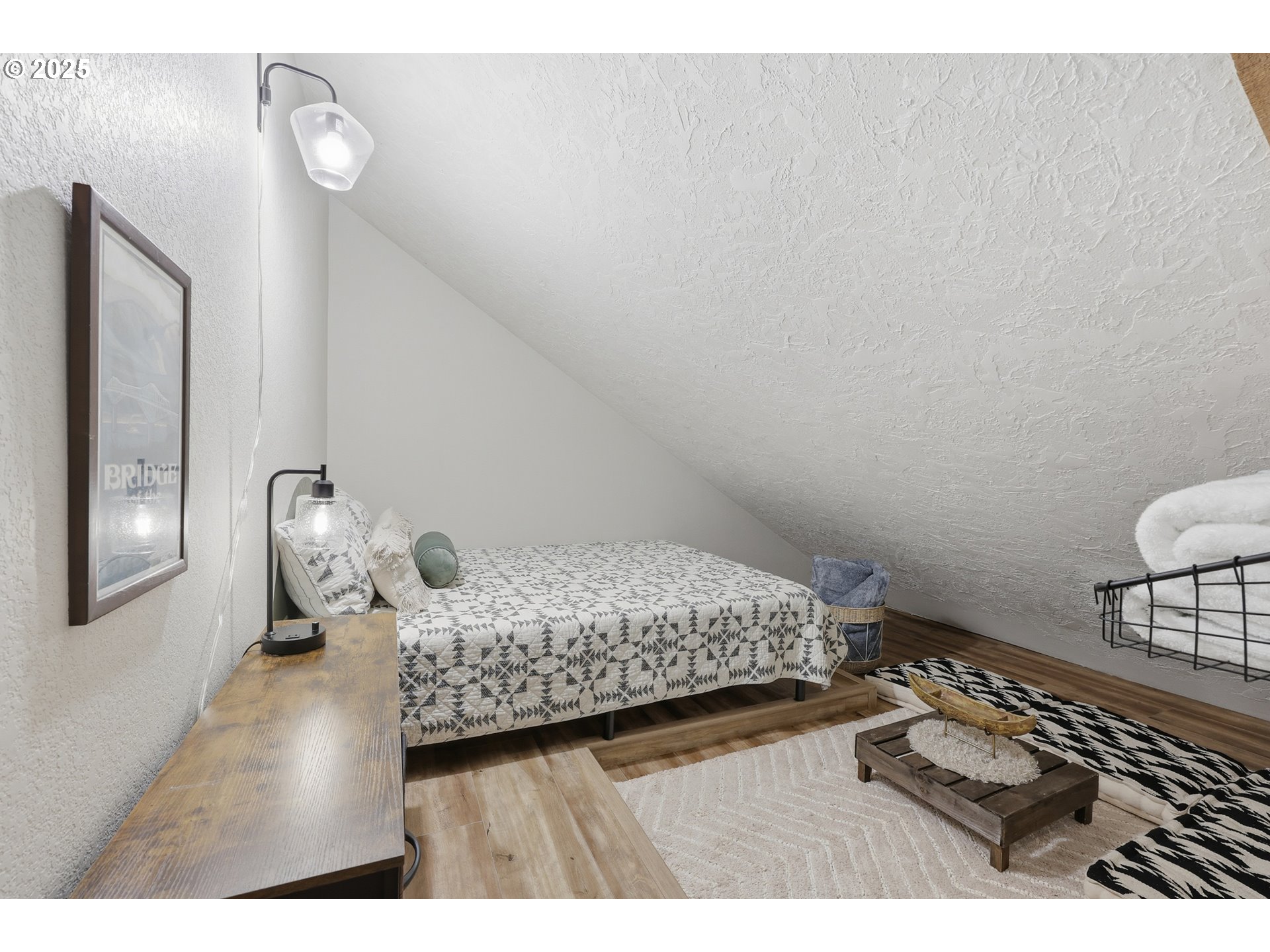 65582 East Timberline Drive Rhododendron, OR 97049 - Photo 30 of 47 a bedroom with a bed and wooden floor