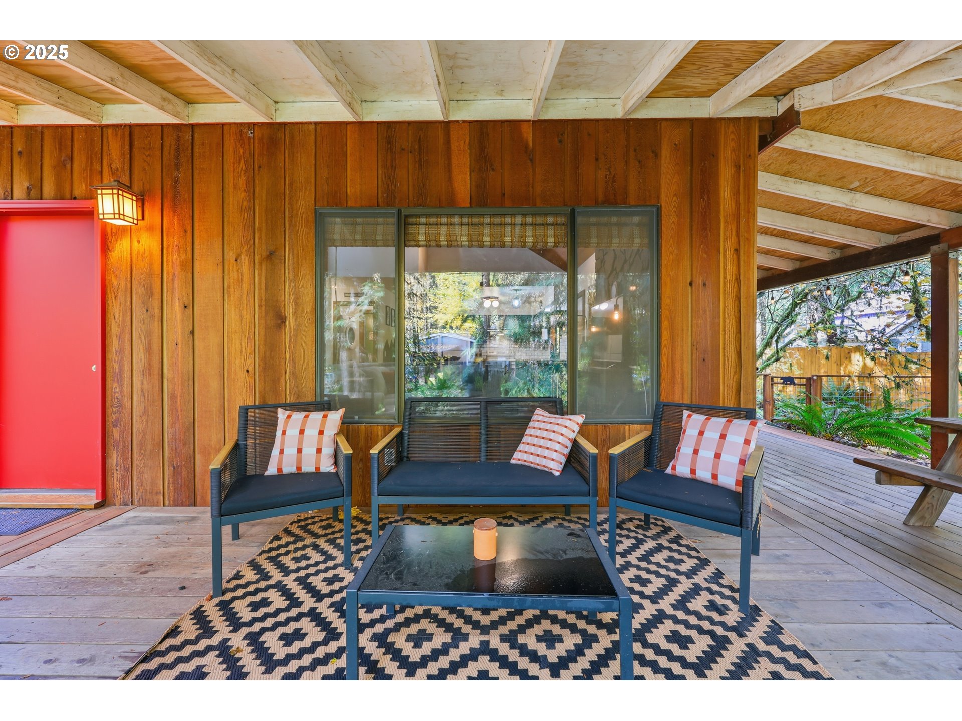 65582 East Timberline Drive Rhododendron, OR 97049 - Photo 31 of 47 an outdoor sitting area with a couch and wooden floor