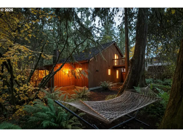 a view of a park with iron fence