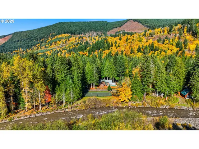 a balcony with chairs and a table