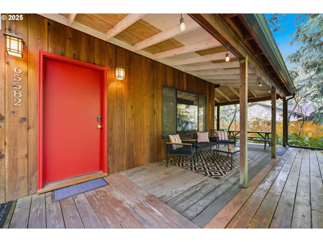 a view of a living room and entryway