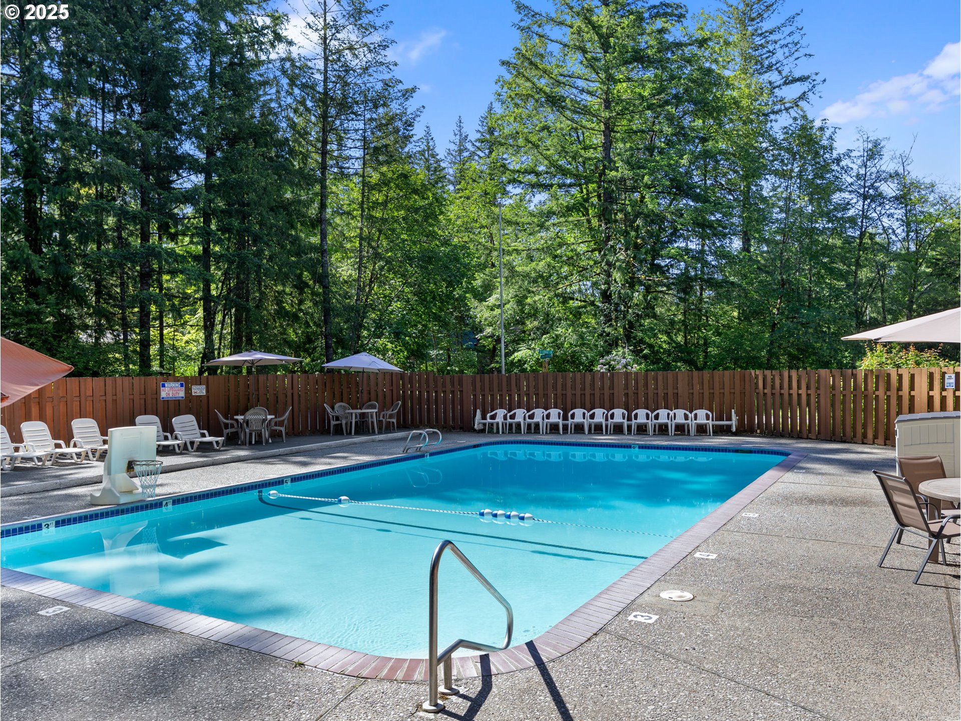 65582 East Timberline Drive Rhododendron, OR 97049 - Photo 43 of 47 a balcony with chairs and a table