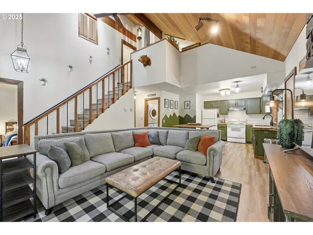 a open kitchen with a table chairs and a stove