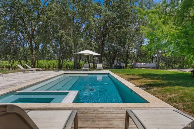 a view of swimming pool with a yard