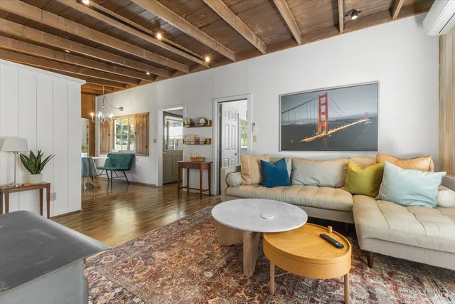 a living room with furniture and a table