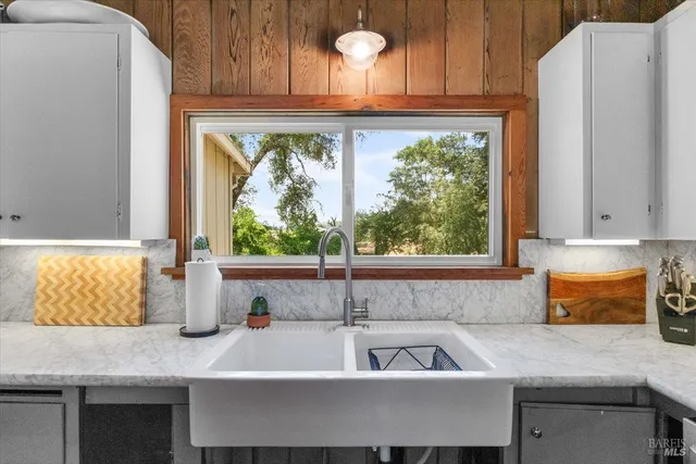 a kitchen with a sink and a window