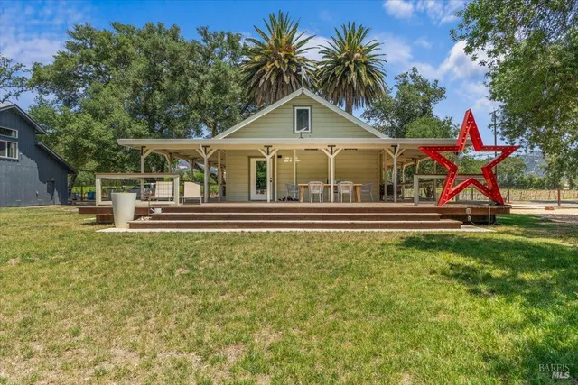 a front view of house with yard and green space