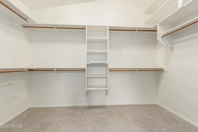 a view of an empty walk in closet