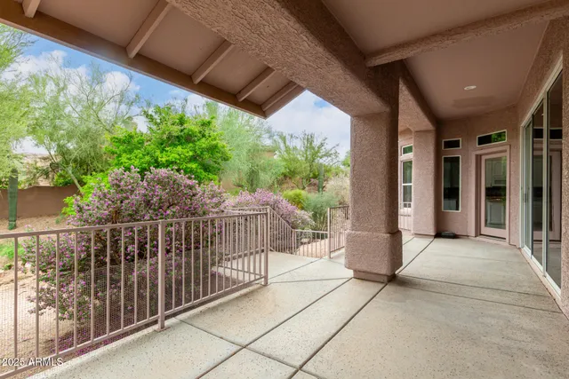 a view of a porch with wooden floor