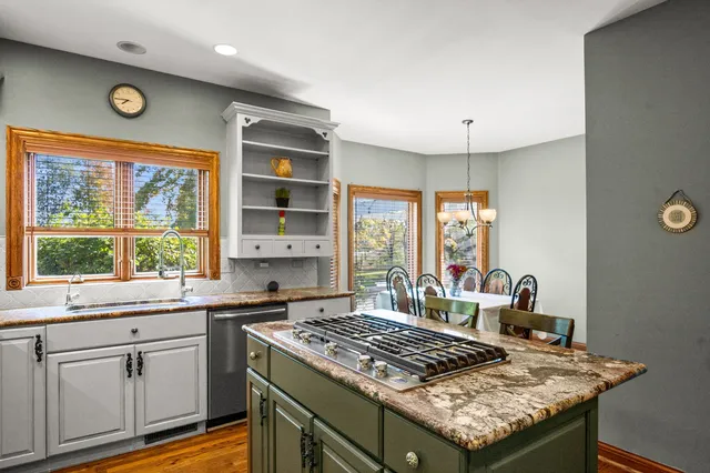 a kitchen with a stove and a sink