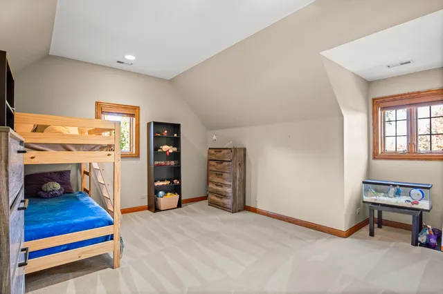 a view of a livingroom with furniture and a flat screen tv