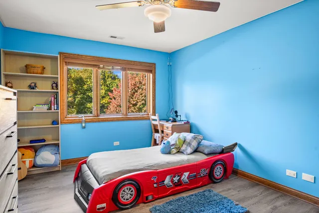 a bedroom with furniture and a window