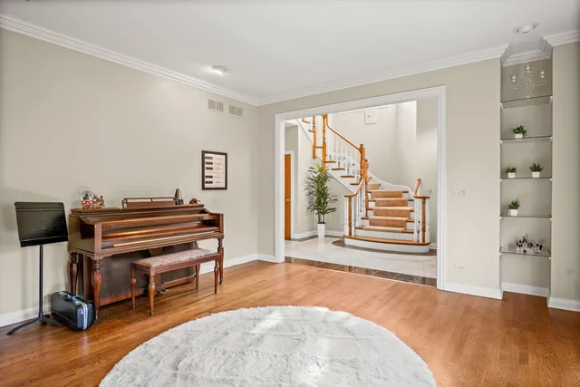 a livingroom with furniture and a piano
