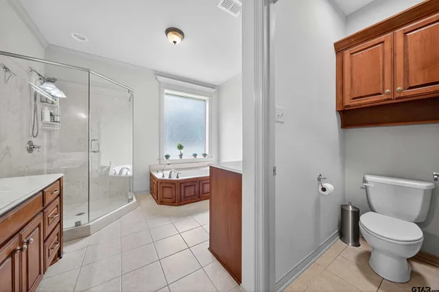 a bathroom with a toilet a sink and bathtub