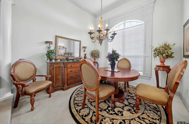 a view of a livingroom with furniture and a chandelier
