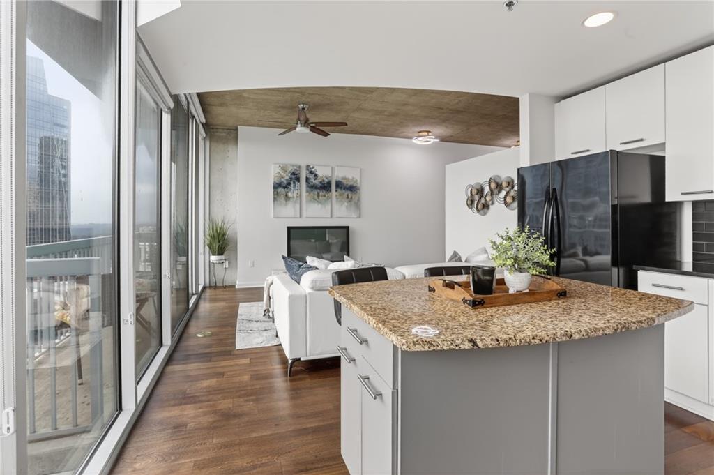 3324 Peachtree Road Northeast, Unit 1312 Atlanta, GA 30326 - Photo 19 of 23 a kitchen with sink cabinets and appliances